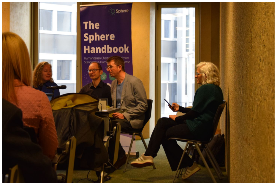 From left to right, Bernadette Sexton (RedR), Primo Amrein (Microsoft), and Tristan Hale (Sphere) speak at a panel hosted by Ana Pinto de Oliveira (University of Algarve) 